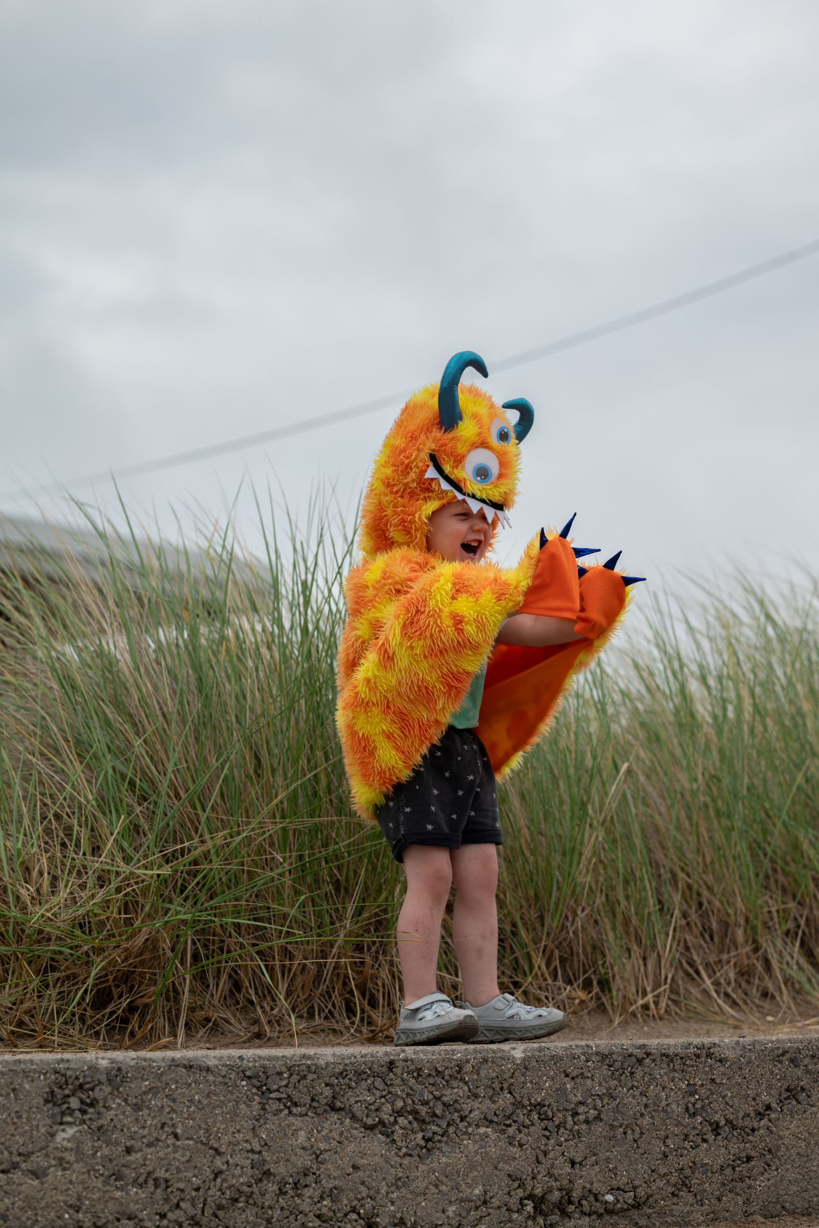 Giggle the Monster Cape, Orange/Yellow